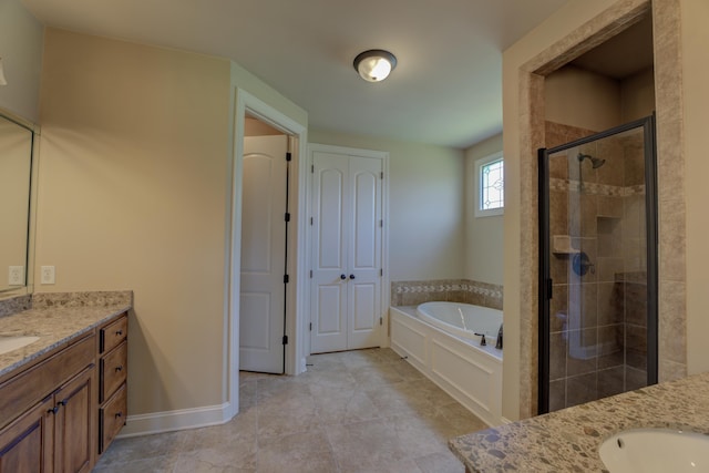 bathroom with shower with separate bathtub and vanity