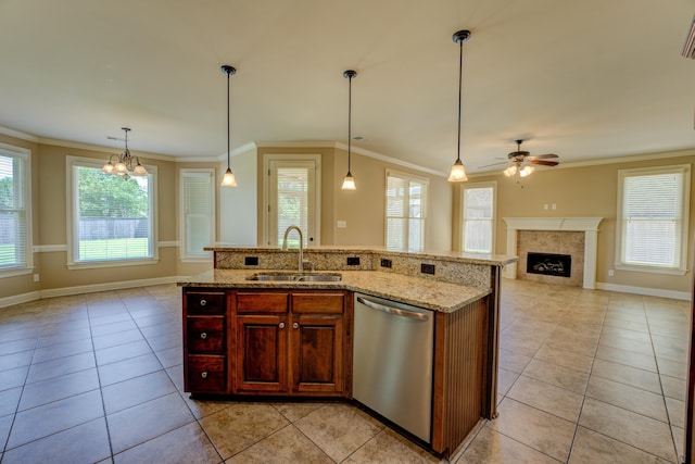 kitchen featuring sink, a center island with sink, decorative light fixtures, and dishwasher