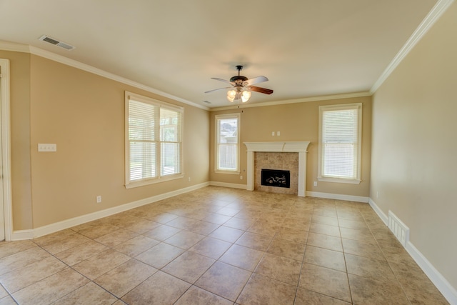 unfurnished living room featuring ornamental molding, light tile patterned floors, and a healthy amount of sunlight