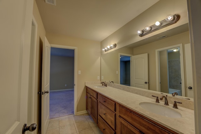 bathroom with vanity and tile patterned flooring