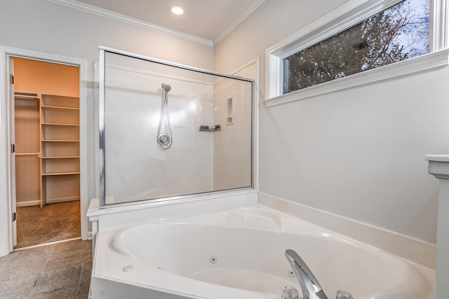 bathroom featuring ornamental molding and independent shower and bath