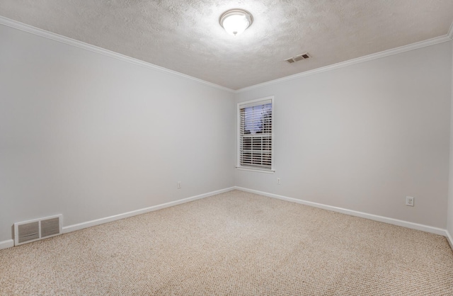 carpeted empty room featuring a textured ceiling and crown molding