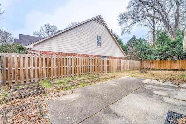 view of side of home with a patio