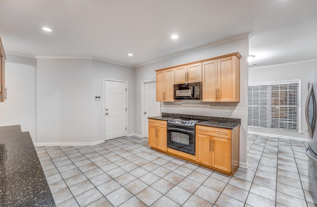 kitchen featuring crown molding, dark stone countertops, and black appliances