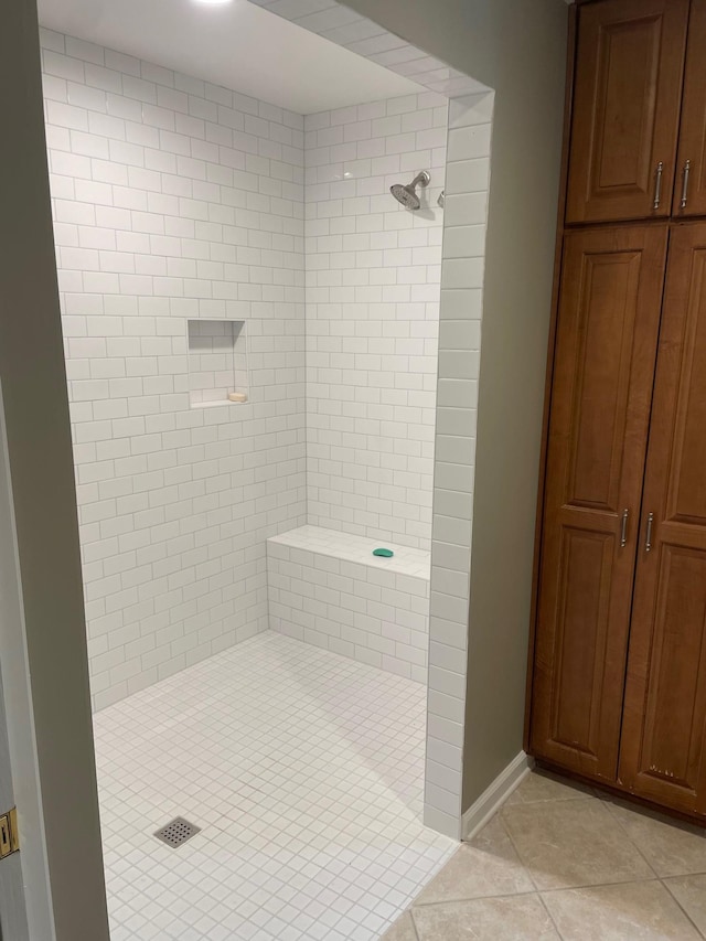 bathroom featuring a shower and tile patterned flooring