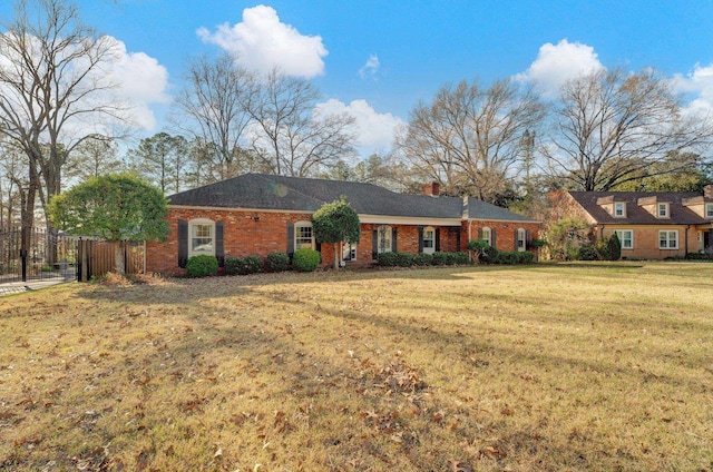 ranch-style home with a front lawn