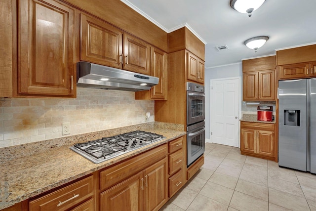 kitchen featuring stainless steel appliances, crown molding, light tile patterned floors, light stone counters, and backsplash