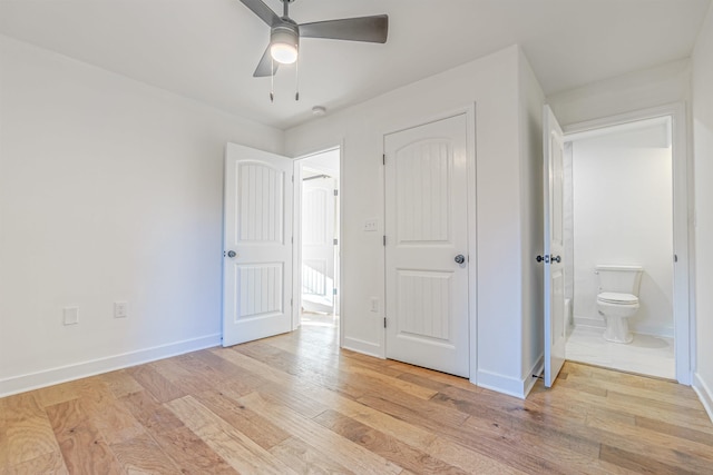 unfurnished bedroom featuring ensuite bathroom, ceiling fan, and light hardwood / wood-style floors