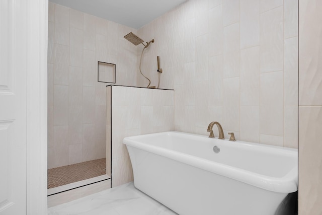 bathroom featuring tile walls and plus walk in shower