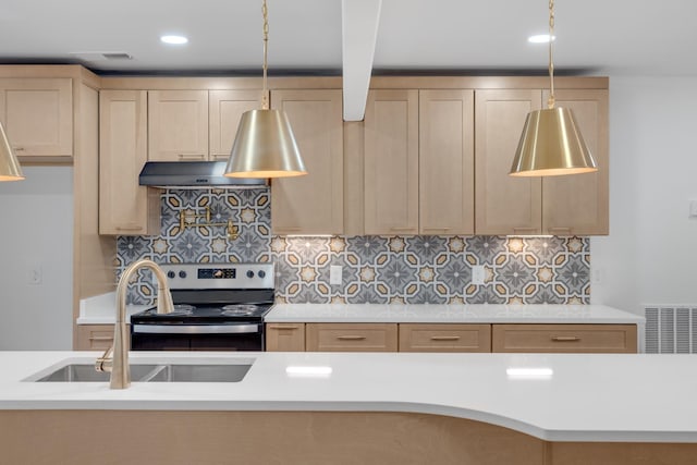 kitchen with pendant lighting, light brown cabinets, decorative backsplash, stainless steel electric range oven, and sink