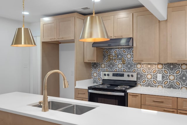 kitchen with stainless steel electric stove, hanging light fixtures, light brown cabinetry, sink, and backsplash