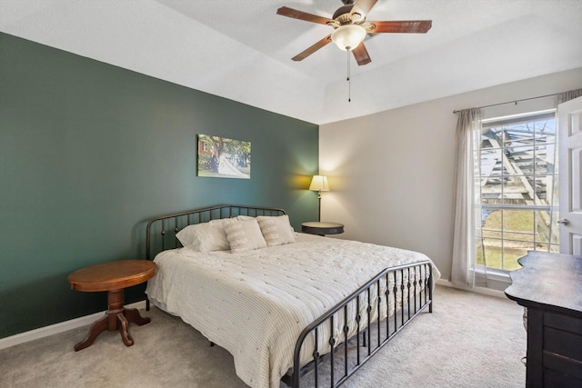 carpeted bedroom with lofted ceiling and ceiling fan