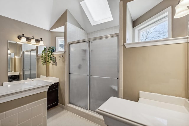 bathroom with lofted ceiling with skylight, an enclosed shower, and plenty of natural light