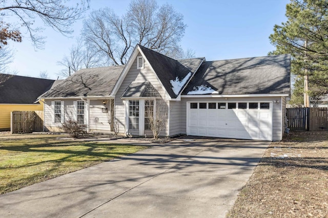 view of front of home with a front yard and a garage