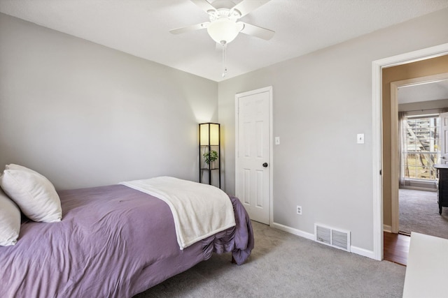 carpeted bedroom featuring ceiling fan