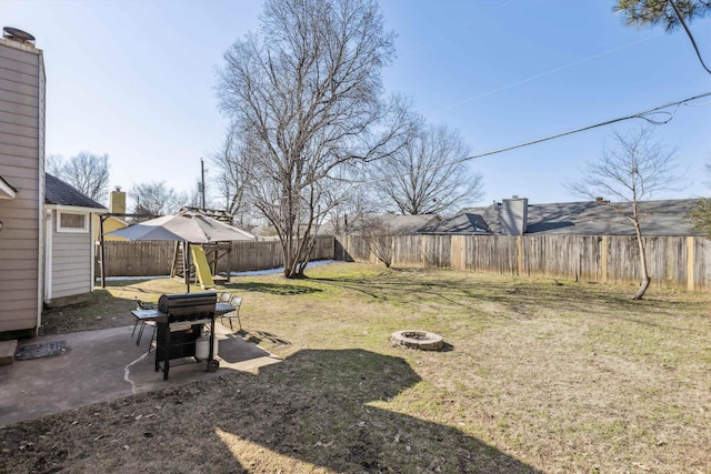 view of yard with an outdoor fire pit and a patio