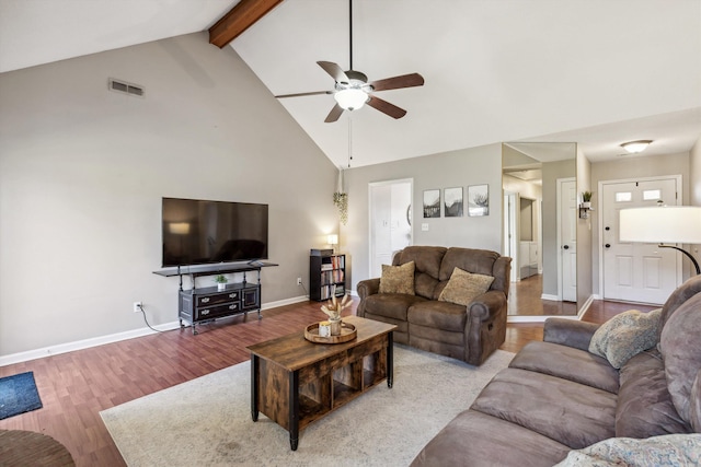 living room featuring ceiling fan, light hardwood / wood-style flooring, high vaulted ceiling, and beamed ceiling