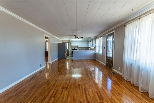 unfurnished living room with ornamental molding, ceiling fan, and dark hardwood / wood-style flooring