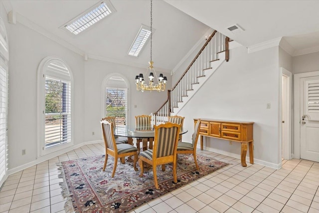 dining area featuring light tile patterned flooring, an inviting chandelier, and ornamental molding