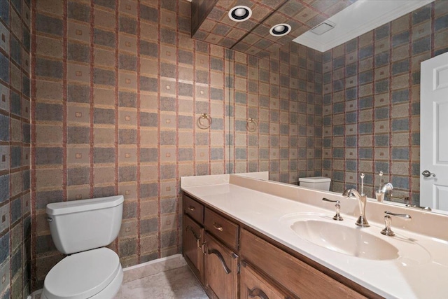 bathroom featuring toilet and vanity