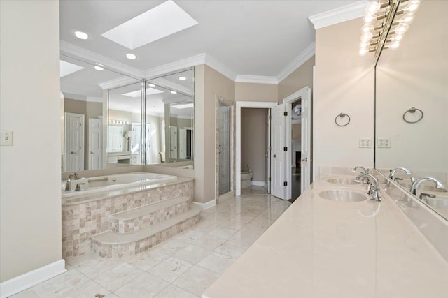 bathroom featuring a skylight, a bidet, vanity, ornamental molding, and tiled tub