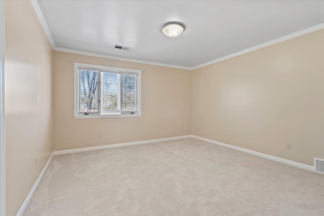 carpeted empty room featuring crown molding