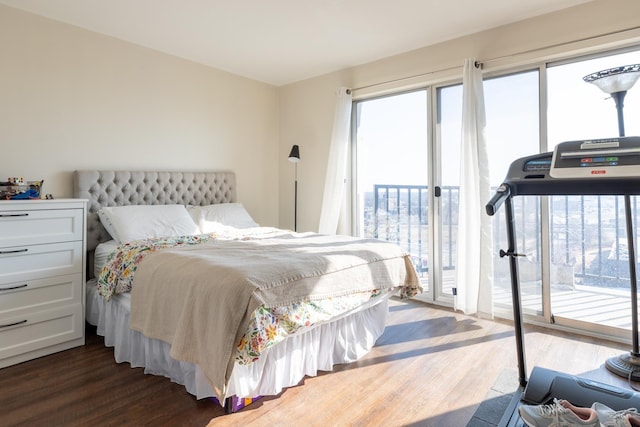 bedroom featuring dark wood-type flooring and access to outside