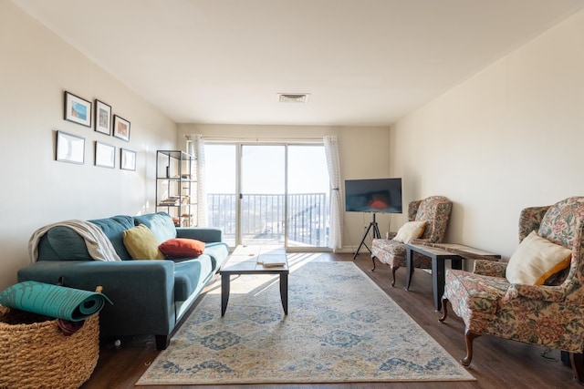 living room with dark hardwood / wood-style floors