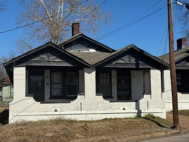 view of side of home with a porch