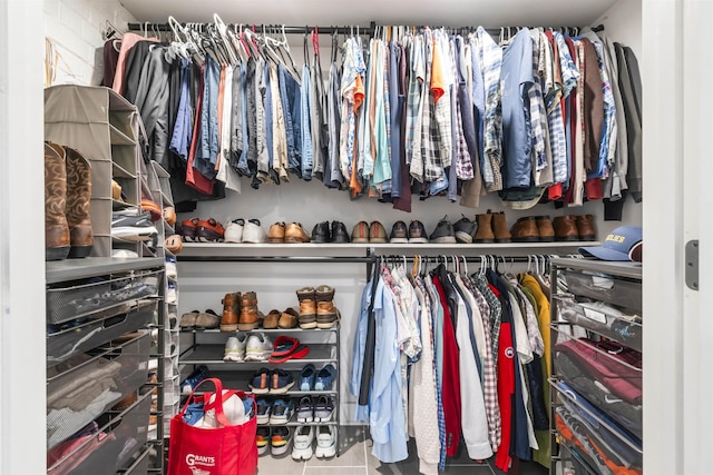 walk in closet with tile patterned floors