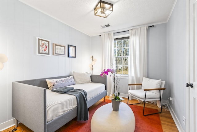 bedroom featuring wood-type flooring