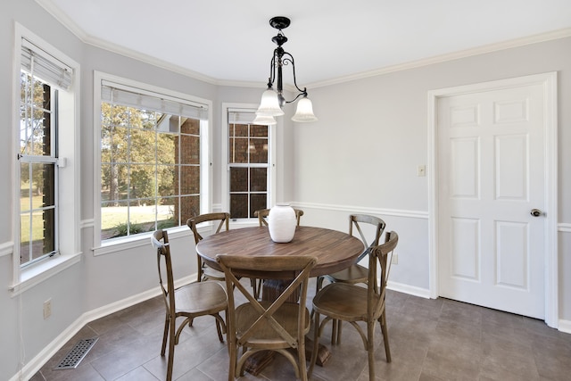 tiled dining room with crown molding