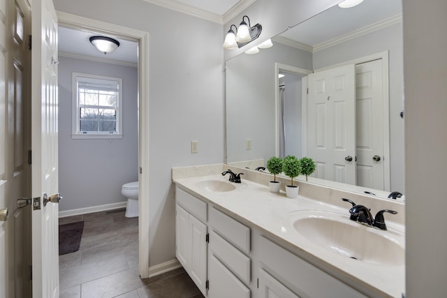 bathroom featuring toilet, tile patterned flooring, ornamental molding, and vanity