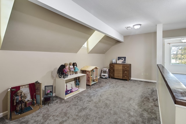 recreation room featuring vaulted ceiling and carpet floors