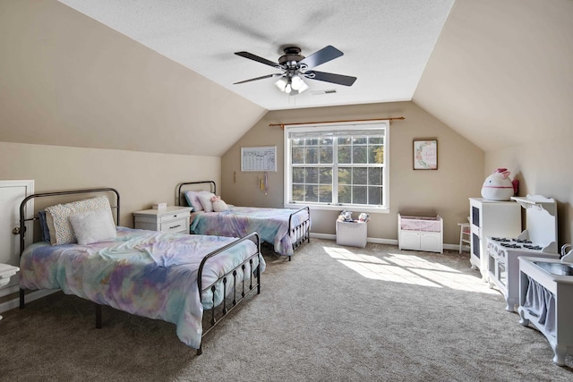 bedroom with lofted ceiling, a textured ceiling, ceiling fan, and light carpet