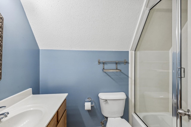 full bathroom featuring a textured ceiling, lofted ceiling, toilet, enclosed tub / shower combo, and vanity