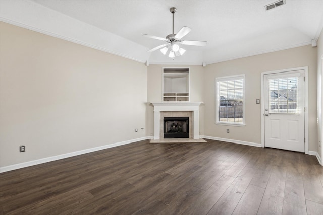 unfurnished living room with a fireplace, ceiling fan, vaulted ceiling, and dark wood-type flooring