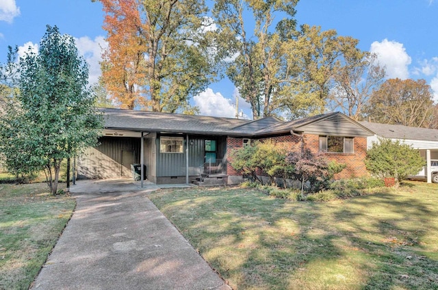 single story home featuring a carport and a front yard