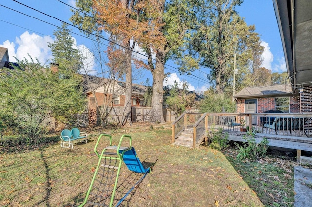 view of yard featuring a wooden deck