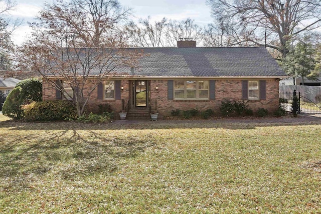 single story home featuring a front lawn