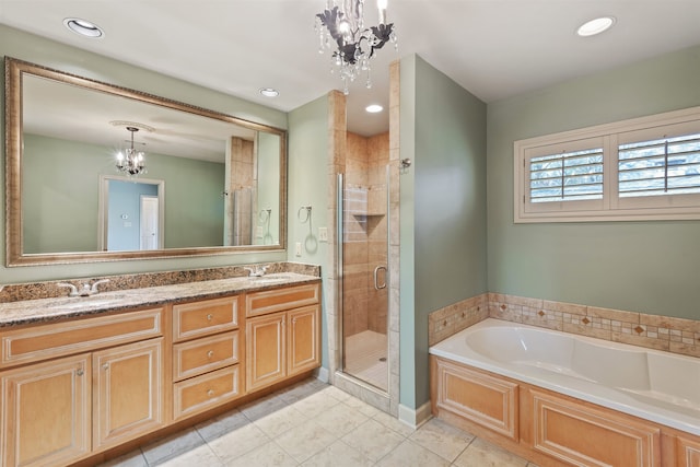 bathroom with vanity, tile patterned flooring, independent shower and bath, and a notable chandelier