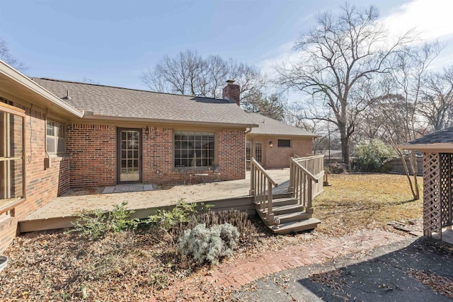 back of property featuring a deck