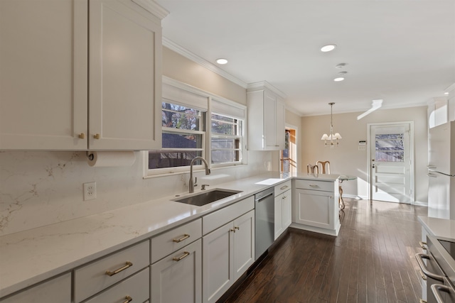 kitchen featuring sink, white cabinetry, dishwasher, and hanging light fixtures