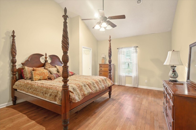 bedroom with ceiling fan, light wood-type flooring, and lofted ceiling