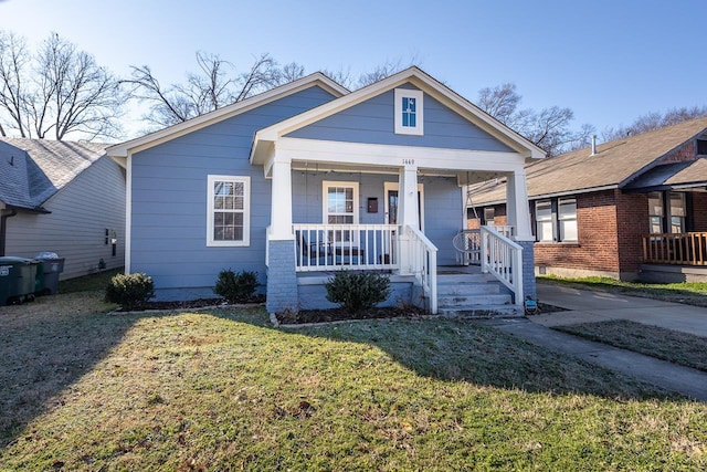 view of front of house featuring a porch and a front lawn