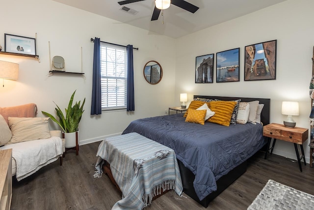 bedroom with dark hardwood / wood-style flooring and ceiling fan