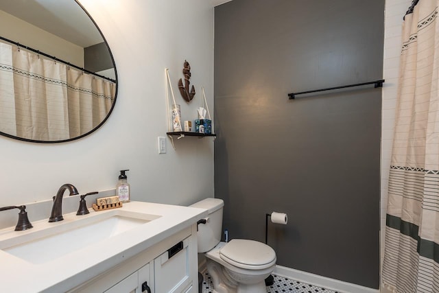 bathroom featuring toilet and vanity