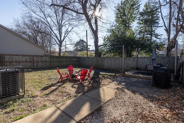 view of yard with a patio area and central AC unit