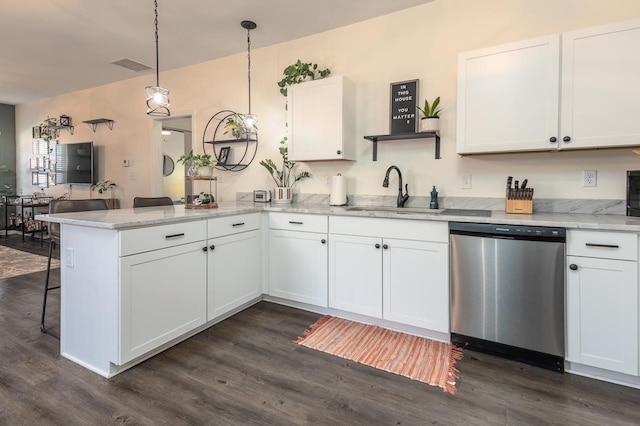 kitchen with sink, white cabinets, decorative light fixtures, dishwasher, and kitchen peninsula