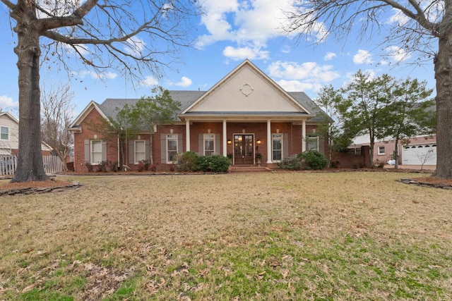 view of front of property featuring a porch and a front yard